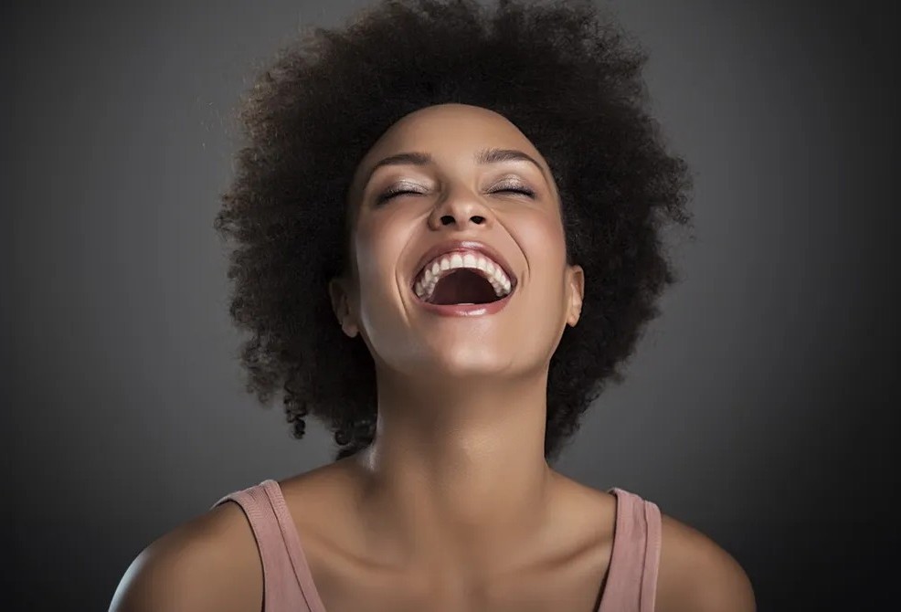 Smiling woman showing her teeth for composite fillings and cosmetic tooth repair